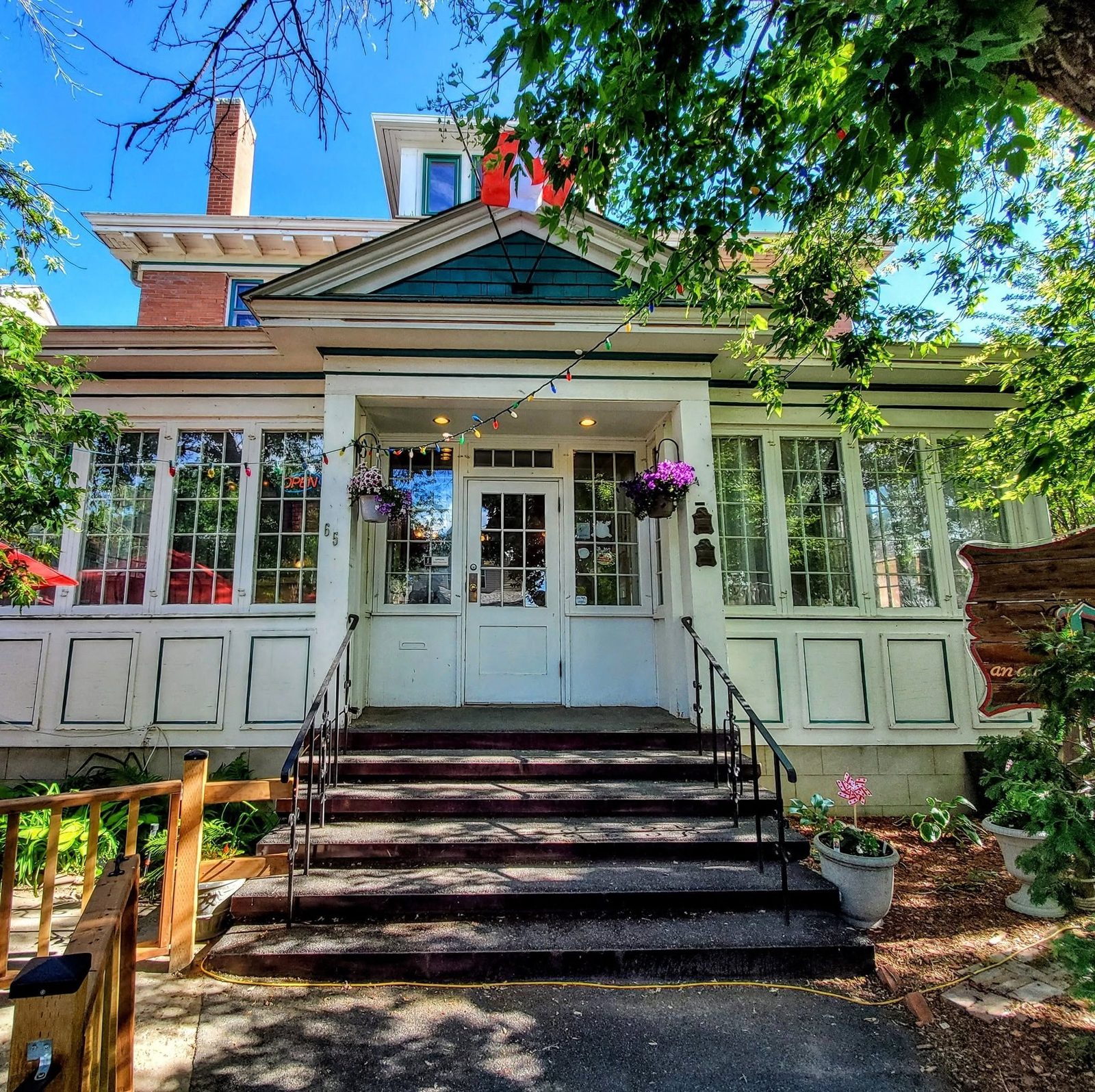 The front veranda and steps of the Hopkins Residence in summer